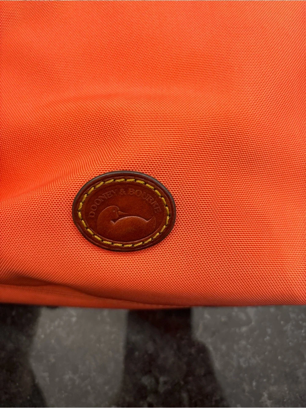 Dooney & Bourke Bright Orange Crossbody with Brown Leather Strap